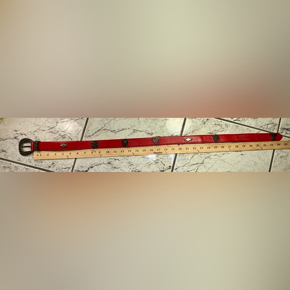 Title:
Vintage Ginnie Johansen Red Leather Western Belt w/ Ornate Silver Buckle - Picture 4 of 5